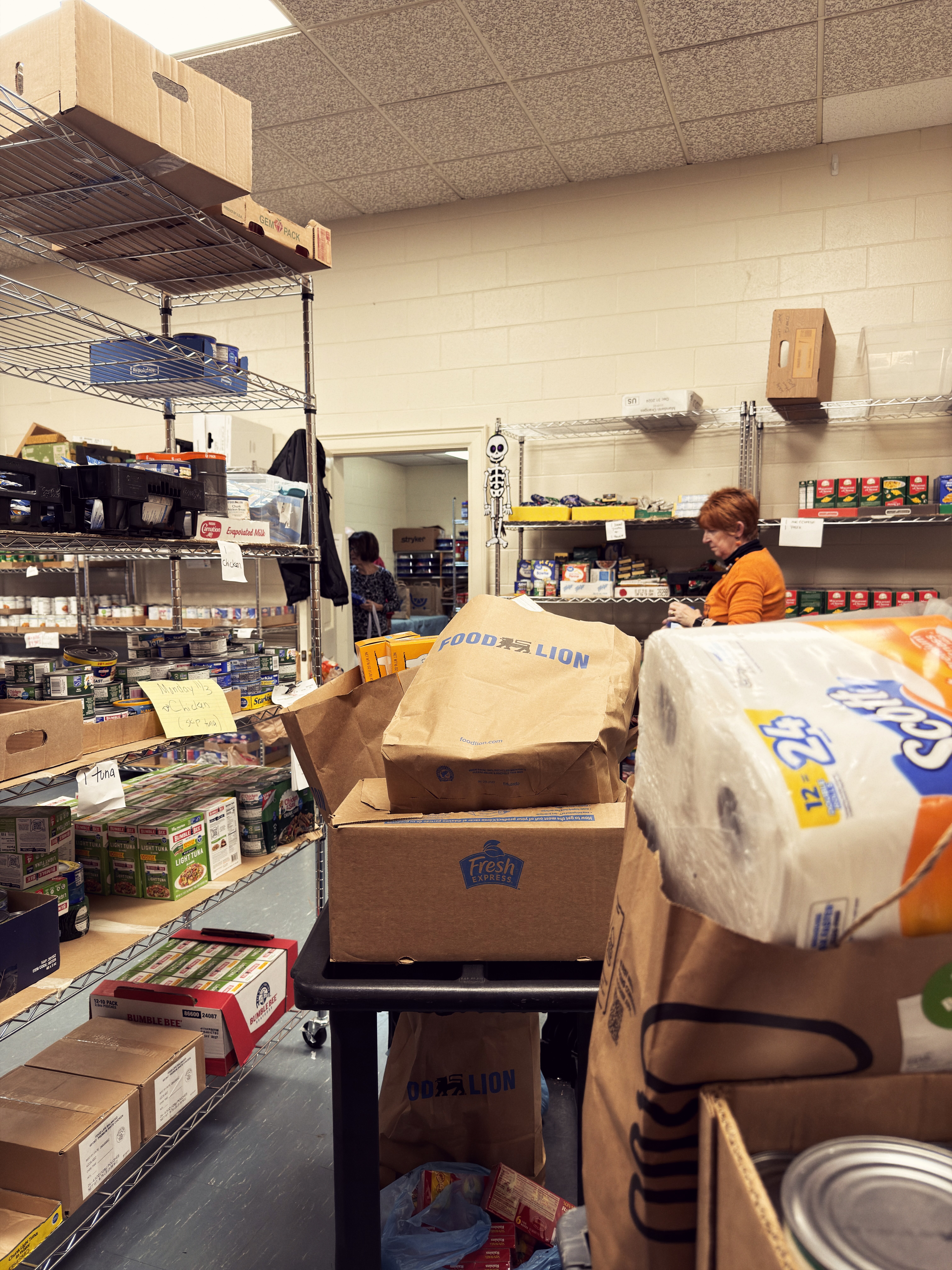 Volunteers organizing groceries at the Welborne Community Food Pantry